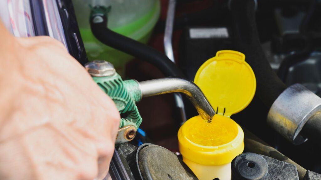 Fill the windshield washer fluid reservoir.